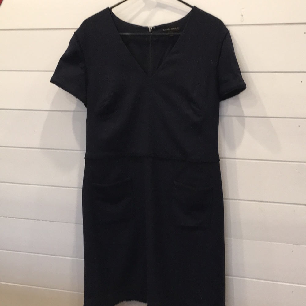 Navy, with speckles and grosgrain ribbon details.